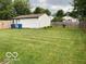 Large backyard with lush green grass and a wood fence, offering privacy at 2650 Woodrow Ave, Indianapolis, IN 46241