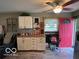 Bonus space with an exterior door, bright pink trim and an office nook at 2650 Woodrow Ave, Indianapolis, IN 46241