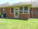 Backyard showing exterior of home and enclosed porch with brick at 2996 Colony Lake W Dr, Plainfield, IN 46168