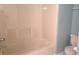 Clean bathroom features a tiled shower-tub combination and modern toilet at 2996 Colony Lake W Dr, Plainfield, IN 46168