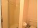 Bathroom including tile shower with glass door and modern toilet at 2996 Colony Lake W Dr, Plainfield, IN 46168