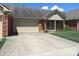 Charming single-story home with a brick facade, attached garage and well-maintained landscaping at 2996 Colony Lake W Dr, Plainfield, IN 46168