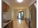 Functional kitchen featuring wood cabinets, stainless steel appliances, and a view into the dining area at 2996 Colony Lake W Dr, Plainfield, IN 46168