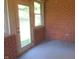 Enclosed brick patio with door and windows leading to the backyard at 2996 Colony Lake W Dr, Plainfield, IN 46168