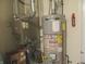 Utility room including furnace, hot water heater, and fire extinguisher at 2996 Colony Lake W Dr, Plainfield, IN 46168