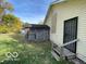 View of backyard with shed and gated porch entrance at 3026 S Rybolt Ave, Indianapolis, IN 46241
