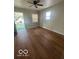 Bedroom featuring wood look floors and a ceiling fan at 3026 S Rybolt Ave, Indianapolis, IN 46241