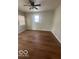 An empty bedroom featuring hard wood floors at 3026 S Rybolt Ave, Indianapolis, IN 46241