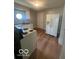 The kitchen features white appliances and wood look floors at 3026 S Rybolt Ave, Indianapolis, IN 46241
