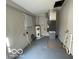 Utility room featuring a water heater, HVAC system, and a window at 3026 S Rybolt Ave, Indianapolis, IN 46241