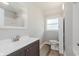 Well-lit bathroom featuring modern fixtures, and wood-look flooring at 3149 Thayer St, Indianapolis, IN 46222