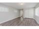 Bedroom featuring lots of natural light, closet, and wood-look flooring at 3149 Thayer St, Indianapolis, IN 46222
