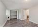 Spacious bedroom featuring wood-look flooring, closet, and light gray walls at 3149 Thayer St, Indianapolis, IN 46222