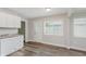Cozy dining area features lots of natural light and wood-look flooring at 3149 Thayer St, Indianapolis, IN 46222