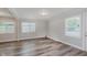 Bright living room with neutral tones, hardwood flooring, and multiple windows at 3149 Thayer St, Indianapolis, IN 46222