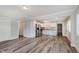 Open-concept space features hardwood flooring, fresh paint, and stainless steel appliances at 3149 Thayer St, Indianapolis, IN 46222