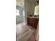 Modern bathroom with wood vanity, updated fixtures, and walk-in glass shower at 336 Brookside Ln, Plainfield, IN 46168