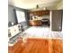 Charming kitchen features wood cabinets, stainless steel appliances, and new floors at 336 Brookside Ln, Plainfield, IN 46168