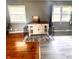 Living area with hardwood flooring, white and brown accent table, and gray walls at 336 Brookside Ln, Plainfield, IN 46168