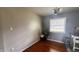 Cozy room bathed in natural light with hardwood floors and neutral paint at 336 Brookside Ln, Plainfield, IN 46168