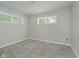 Empty bedroom featuring neutral walls, carpeted flooring, and a window at 3538 N Elizabeth St, Indianapolis, IN 46226