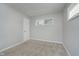 Empty bedroom featuring neutral walls, carpeted flooring, and a window at 3538 N Elizabeth St, Indianapolis, IN 46226