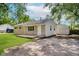 Exterior view of a one-story home with a detached garage and green lawn at 3538 N Elizabeth St, Indianapolis, IN 46226