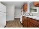 Efficient kitchen with laminate flooring, wood cabinets, and modern appliances at 3538 N Elizabeth St, Indianapolis, IN 46226
