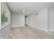 Spacious living room with neutral carpet, a ceiling fan, and a large window at 3538 N Elizabeth St, Indianapolis, IN 46226