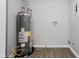 Utility room featuring a Rheem Performance water heater and painted block walls at 3538 N Elizabeth St, Indianapolis, IN 46226