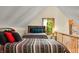Bright bedroom features two twin beds with patterned bedding and a window view at 3715 Orchard Rd, Columbus, IN 47201