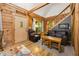 Cozy cabin living room with leather seating and staircase at 3715 Orchard Rd, Columbus, IN 47201