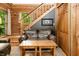 Comfortable living room showcasing a leather sofa, wooden coffee table, and natural lighting at 3715 Orchard Rd, Columbus, IN 47201
