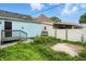 Backyard featuring blue siding and a small porch with a small fenced-in area to the right at 410 Montgomery St, Shelbyville, IN 46176