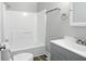 Bathroom featuring a modern vanity, standard shower and toilet combo with a clean finish at 410 Montgomery St, Shelbyville, IN 46176