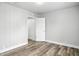 Bedroom featuring modern vinyl flooring and neutral paint, with ample closet space visible at 410 Montgomery St, Shelbyville, IN 46176