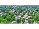 A tree-filled neighborhood with cozy homes, well-maintained streets and a marked location at 4129 Cornelius Ave, Indianapolis, IN 46208