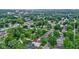 A vibrant neighborhood with lush trees, cozy homes, and a marked location at 4129 Cornelius Ave, Indianapolis, IN 46208