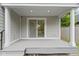 Back porch with sliding glass door leading to the inside at 4129 Cornelius Ave, Indianapolis, IN 46208