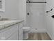 Bathroom featuring shower, toilet, and sink with vanity at 4129 Cornelius Ave, Indianapolis, IN 46208