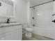 Stylish bathroom with modern fixtures, white subway tiles, and sleek design at 4129 Cornelius Ave, Indianapolis, IN 46208