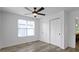 Bright bedroom featuring a ceiling fan, closet, and wood-look flooring at 4129 Cornelius Ave, Indianapolis, IN 46208