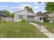 A charming home with a well-manicured lawn and updated siding at 4129 Cornelius Ave, Indianapolis, IN 46208