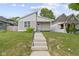 A charming home with a well-manicured lawn and inviting front porch at 4129 Cornelius Ave, Indianapolis, IN 46208