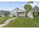 A charming home with a well-manicured lawn and walkway at 4129 Cornelius Ave, Indianapolis, IN 46208