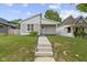 Charming single-story home with a well-manicured lawn and inviting front porch at 4129 Cornelius Ave, Indianapolis, IN 46208