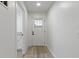 Bright hallway leading to the front door, with a glimpse of a storage area on the left at 4129 Cornelius Ave, Indianapolis, IN 46208