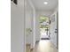 Bright hallway leading to the front door, with a glimpse of a storage area on the left at 4129 Cornelius Ave, Indianapolis, IN 46208