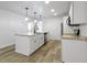 Kitchen with granite countertops, an island with seating, and stainless steel appliances at 4129 Cornelius Ave, Indianapolis, IN 46208