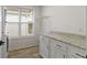 Bright laundry room featuring modern cabinetry, a window, and ample counter space at 4129 Cornelius Ave, Indianapolis, IN 46208